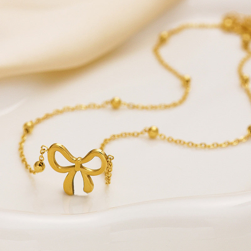 Lakshmira Gold Plated Anti Tarnish Bow Themed Necklace Set