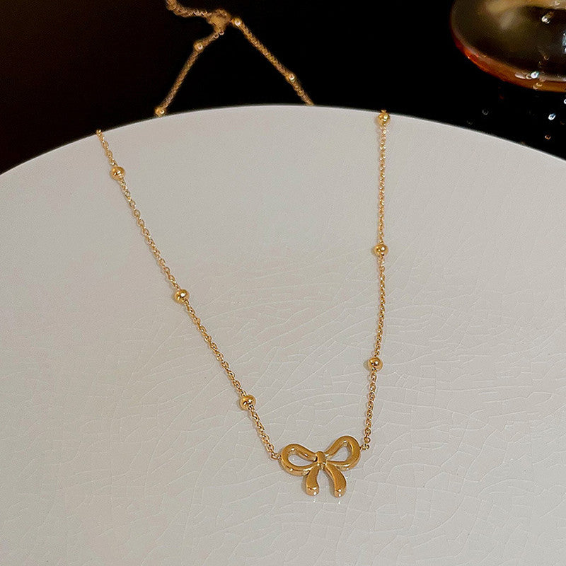 Lakshmira Gold Plated Anti Tarnish Bow Themed Necklace Set