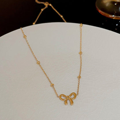 Lakshmira Gold Plated Anti Tarnish Bow Themed Necklace Set
