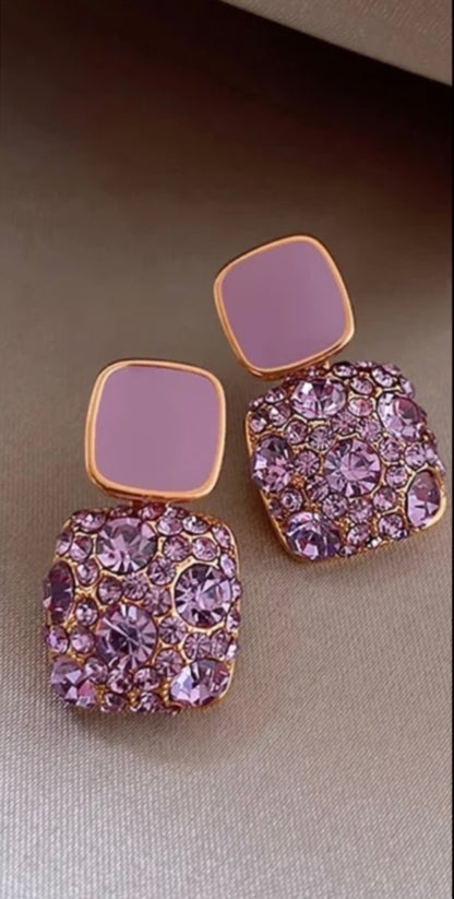 Detailed view of the Lakshmira Square Crystal Rhinestone Earrings in purple, featuring gold plating and stunning square crystals