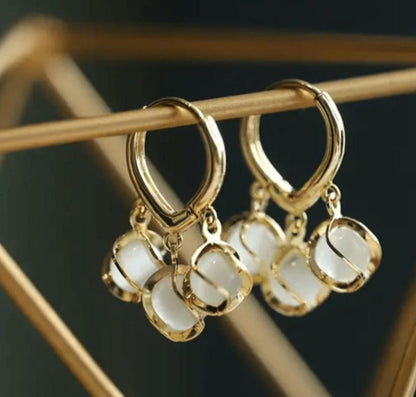 Lakshmira Cozy Crystal Hoop Earrings close-up showing the sparkling crystals set in a gold-plated hoop.