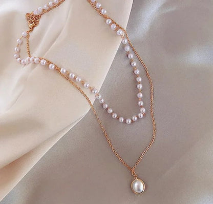 Sophisticated Lakshmira Double Layer Pearl Necklace displayed on a white background, highlighting the layered design and pearl details