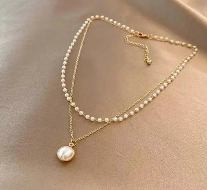 Lakshmira Double Layer Pearl Necklace close-up showcasing the elegant gold-plated chain and delicate pearl accents