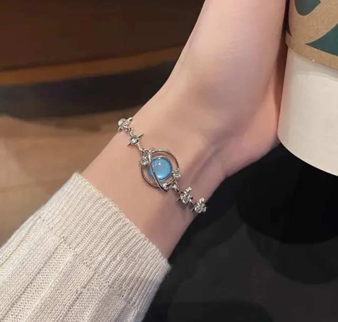 Lakshmira Blue Stone Korean Bracelet close-up showing the silver-plated chain and vibrant blue stone accent.